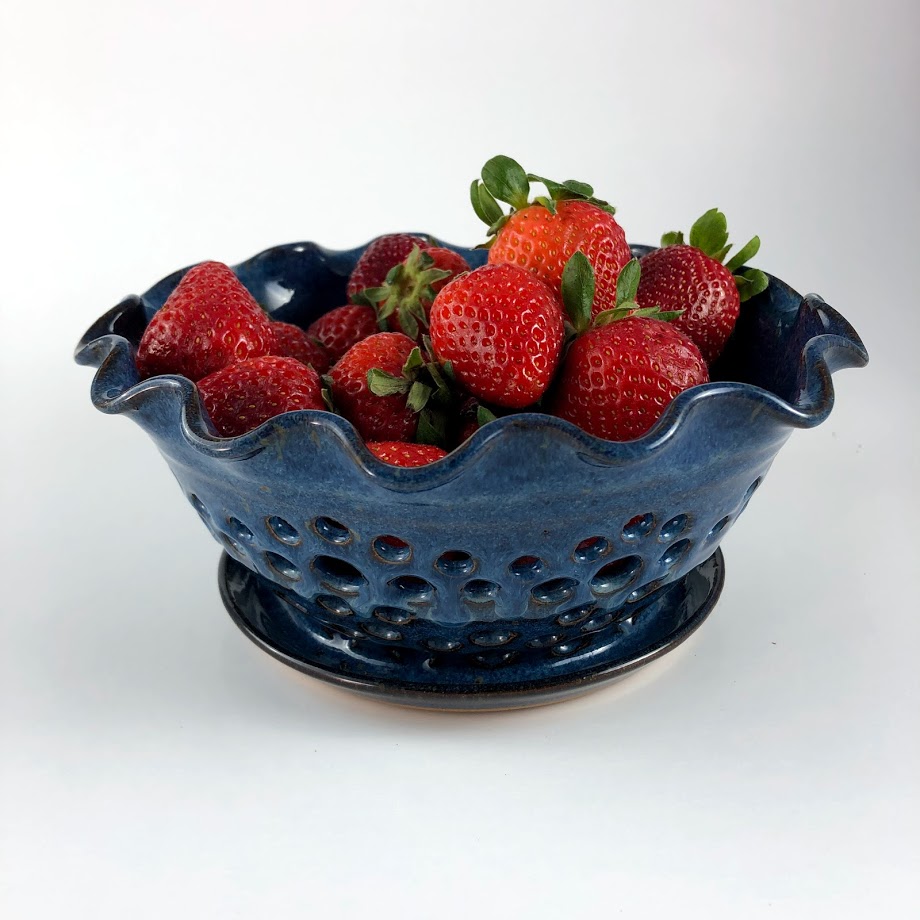 Blue berry bowl holding strawberries
